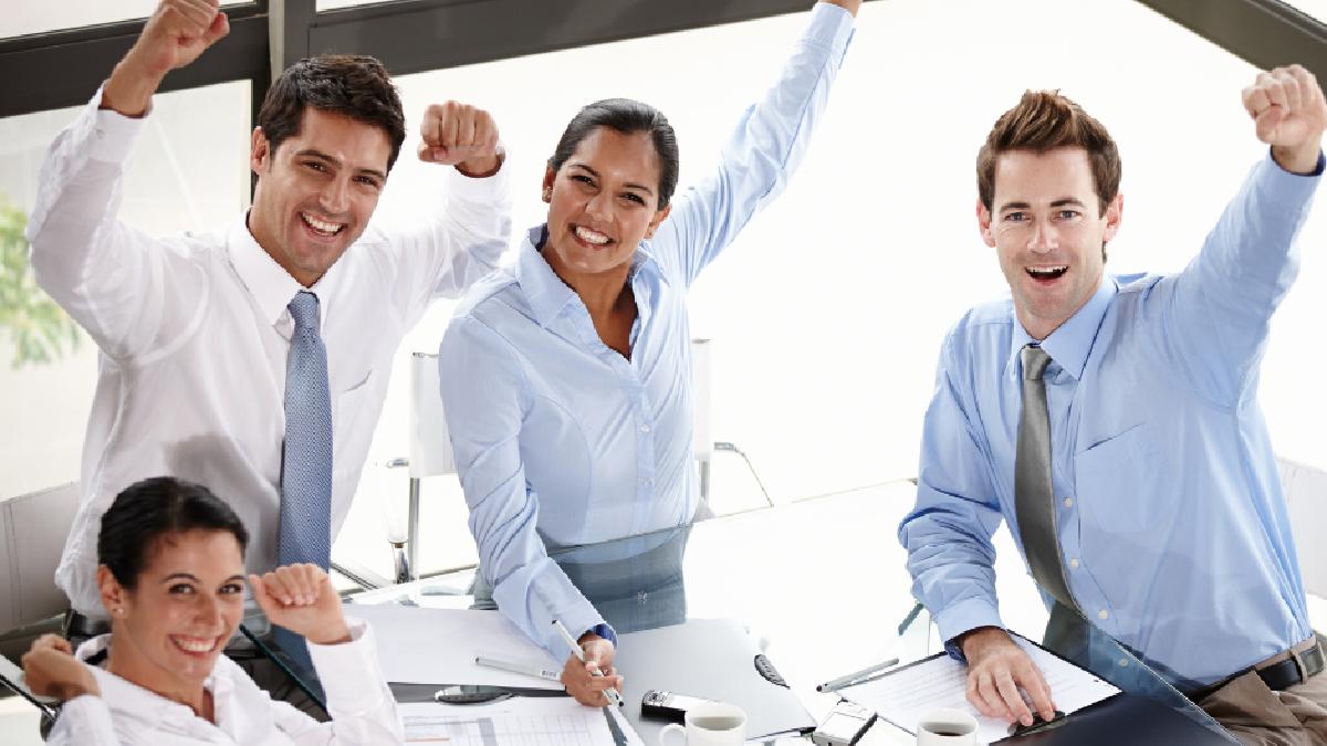 Office workers cheering project win Australia